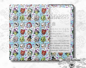 May include: A light blue patterned book cover featuring a repeating design of spooky ice pops with various faces. The book cover has the word "Sadness" and the text "Chapter" printed on it.