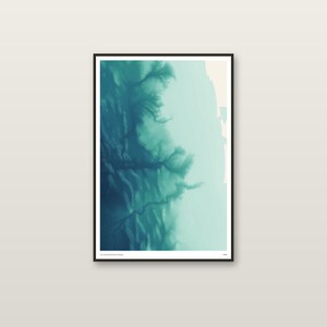 May include: A vertical rectangular wall art print in a black frame featuring an abstract aerial view of a coastline. The image displays deep teal and turquoise gradients representing water and land formations with a light beige strip on the right side.