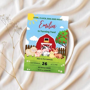 May include: A colorful invitation for a farm-themed birthday party. The invitation features a red barn, a blue sky, green grass, and a variety of farm animals. The text on the invitation reads "OINK, CLUCK, BAA AND MOO! Emilia Is Turning Two!" and includes details for the party, such as the date, time, and location.