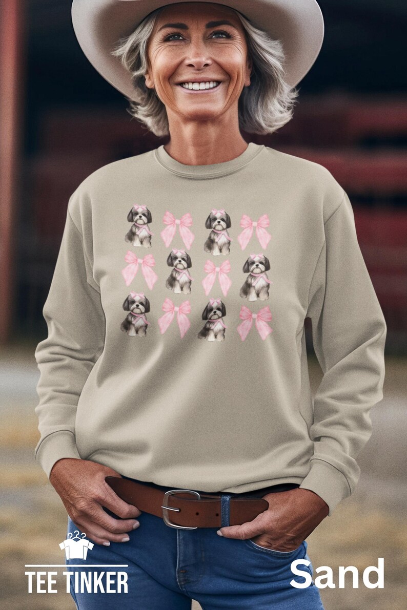 Show off your love for Shih Tzus with this adorable "Shih Tzu with Pink Bows" design! Available in T-Shirt, V-Neck, or Sweatshirt, this cute and playful graphic is perfect for Shih Tzu lovers who want to add a touch of sweetness to their wardrobe.