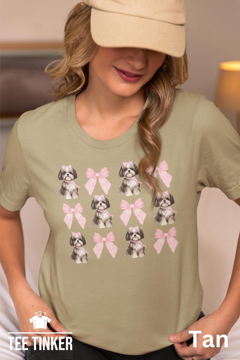 Show off your love for Shih Tzus with this adorable "Shih Tzu with Pink Bows" design! Available in T-Shirt, V-Neck, or Sweatshirt, this cute and playful graphic is perfect for Shih Tzu lovers who want to add a touch of sweetness to their wardrobe.