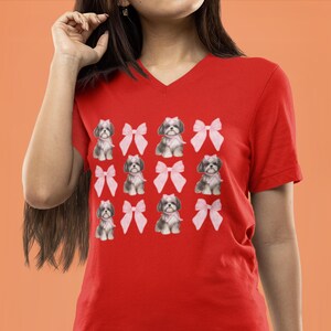 Show off your love for Shih Tzus with this adorable "Shih Tzu with Pink Bows" design! Available in T-Shirt, V-Neck, or Sweatshirt, this cute and playful graphic is perfect for Shih Tzu lovers who want to add a touch of sweetness to their wardrobe.