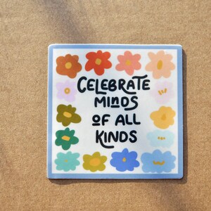 May include: A square sticker with a blue border and a white background. The sticker features a colorful floral design with the text "Celebrate Minds of All Kinds" in black.