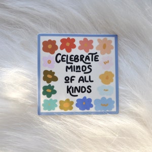 May include: A sticker with a blue border and a white background. The sticker features a colorful floral design with the text "Celebrate Minds of All Kinds" in black.
