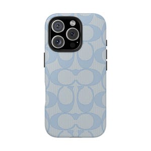 May include: A light blue phone case with a repeating pattern of interlocking oval shapes. The case has a camera cutout with three lenses and a flash. The case is designed to fit a smartphone.