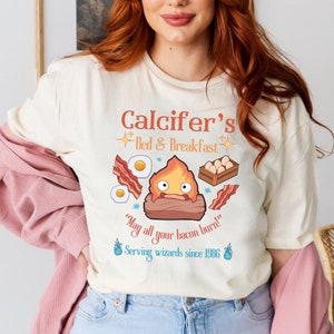 Howl’s Moving Castle Inspired Calcifer's Bed & Breakfast Unisex Softstyle T- Shirt , Anime Shirt, Howl and Sophie Shirt