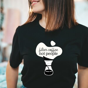 May include: A black t-shirt with a white graphic of a coffee maker and the text "filter coffee not people".