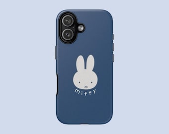 May include: A navy blue phone case featuring a white illustration of a rabbit with the word "miffy" below. The case has a dual-lens camera cutout and black side buttons.