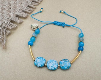 Handmade bracelet with acrylic and natural stone beads in turquoise