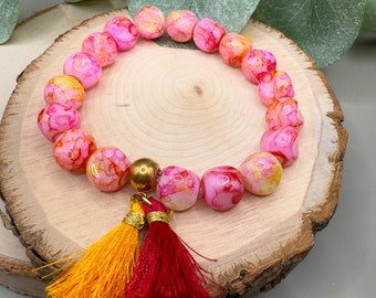 Handgefertigtes & farbenfrohes Glasperlen-Armband mit Goldperle und Quasten
