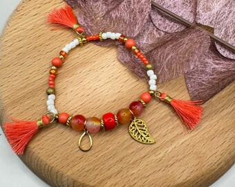 Bracelet ORANGE PARTY - glass beads with gold pendant and tassels