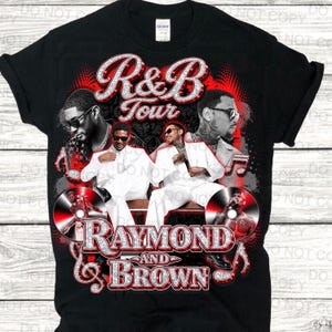 May include: Black t-shirt featuring a graphic design for the R&B Tour with the text "R&B Tour" in a sparkling font. The design includes images of performers and the text "Raymond and Brown". Musical notes and CD graphics are also included.