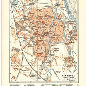 May include: Vintage map of Augsburg, Germany, showing detailed street plans, landmarks, and railway lines. The map uses orange and blue hues, with German text. Scale is 1:20,000.