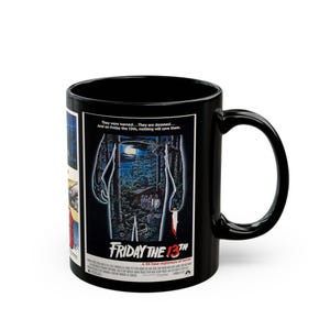 May include: A black ceramic mug featuring the movie poster for Friday the 13th. The graphic displays a dark forest scene with a cabin, a full moon, and the text: They were warned... They are doomed... And on Friday the 13th, nothing will save them.