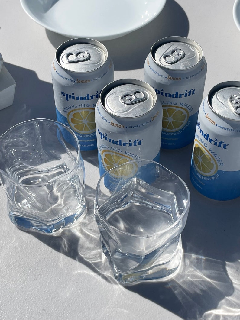 Unique wavy glass coffee cup, ideal for iced coffee and matcha lovers who enjoy Nordic-style drinkware.