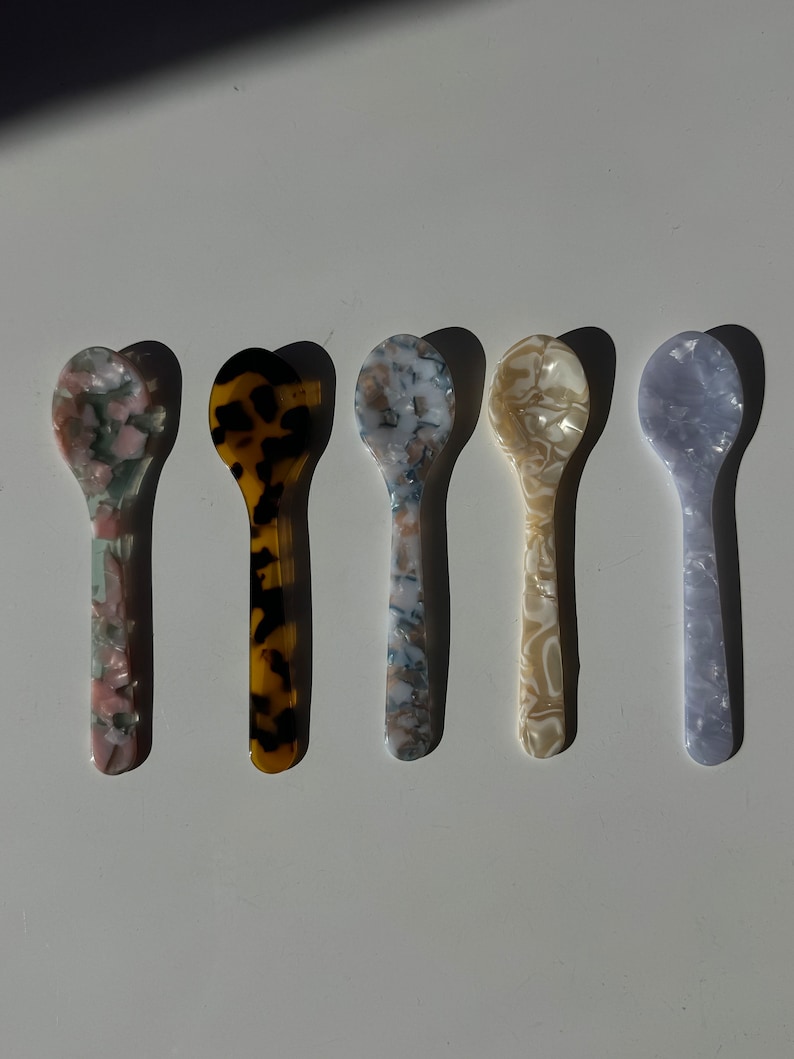 Colorful handmade acrylic dessert spoons, perfect for ice cream, sundaes, and sweet indulgences.