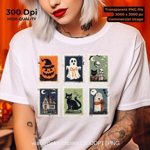 May include: White t-shirt featuring six vintage-style Halloween postage stamp designs. The stamps depict a jack-o'-lantern, ghost, black cat, haunted house, skulls, and a tombstone. The shirt includes the text "watercolor clipart | 300DPI | PNG".