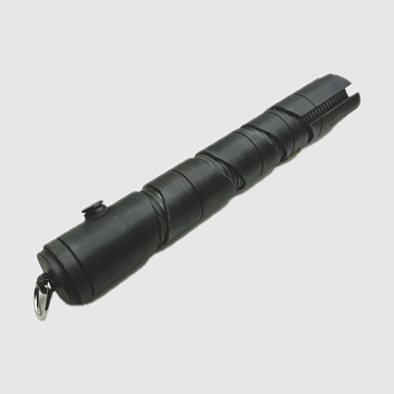 May include: A black lightsaber prop with a textured, spiral design. The lightsaber has a silver loop at the end.