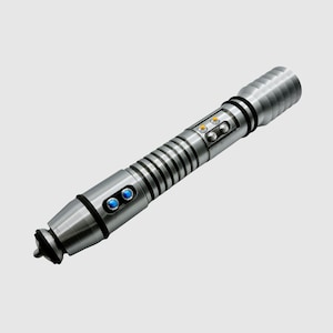 May include: A silver lightsaber with blue and yellow lights. The lightsaber has a textured grip and a black tip.