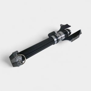 May include: A black and silver lightsaber prop with a cylindrical handle and detailed metallic accents. The prop features a ring at the base and two angled blades near the top. The design is sleek and futuristic, suitable for cosplay or display.