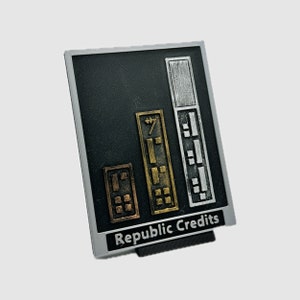 May include: A black card with a gold and silver design. The card has a cityscape design with the words "Republic Credits" at the bottom.