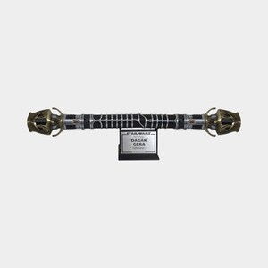 May include: A black lightsaber with gold accents and a silver blade. The lightsaber is on a stand with a silver plaque that reads "STAR WARS: The Black Series DAGAN GERA LIGHTSABER".