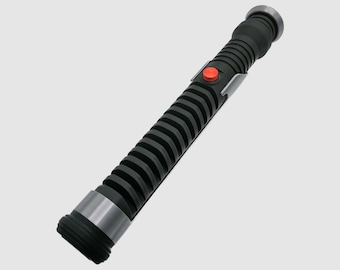 May include: A black lightsaber with a silver band and a red button. The lightsaber has a textured, ribbed design.