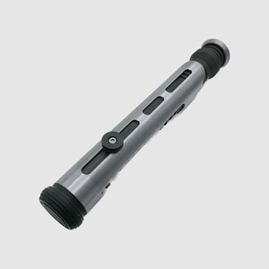 May include: A silver and black lightsaber prop with a textured surface and a black button on the side.