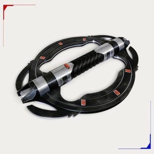 May include: A black and silver double-bladed spinning lightsaber hilt featuring a central textured grip, metallic accents, and a circular outer ring frame adorned with small rectangular red inlays positioned symmetrically around the structure.