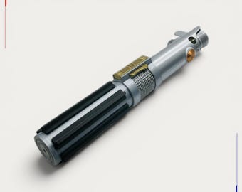 May include: A silver-toned cylindrical prop handle featuring a black-ribbed grip section, a textured metallic mid-section, and a gold-colored rectangular control plate. The upper portion includes a circular orange button and a small metallic lever.