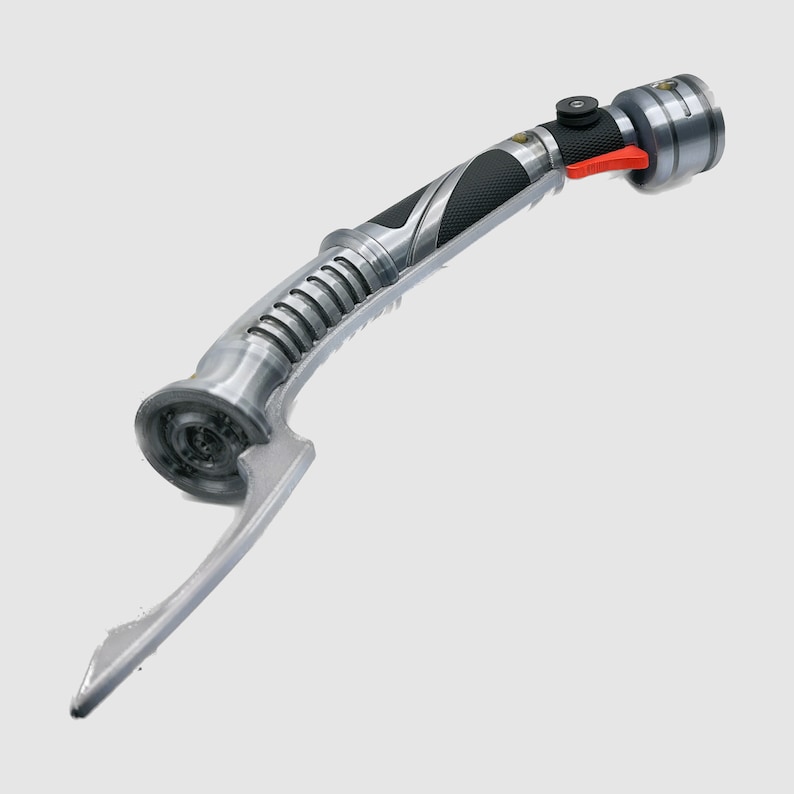 May include: A silver and black lightsaber with a curved handle and a red button. The lightsaber is a popular collectible for fans of the Star Wars franchise.