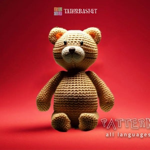 May include: A crocheted teddy bear pattern in multiple languages. The pattern includes instructions for crocheting a brown teddy bear with a white face and black eyes. The pattern is available in English, French, German, Dutch, Spanish, Italian, Polish, Portuguese, and Japanese.
