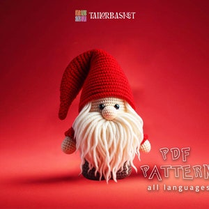 May include: A crocheted gnome doll with a red hat, white beard, and brown pants. The gnome is standing on a red background. The text "PDF PATTERN all languages" is written in white letters on the bottom right corner of the image.