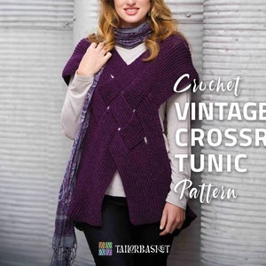 May include: A woman wearing a purple crochet tunic with a criss-cross pattern. The tunic has a V-neck and is worn over a white long-sleeved shirt. The text "Crochet Vintage Crossroad Tunic Pattern" is visible in the image.