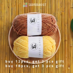 May include: Two balls of yarn, one brown and one yellow, are displayed on a wooden surface. The yarn is labelled "Sweet Candy". The text "buy 12pcs, get 2 pcs gift buy 18pcs, get 3 pcs gift" is also visible.