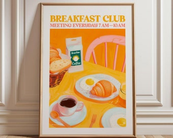May include: A retro-style poster with the text "Breakfast Club Meeting Everyday 7AM-10AM". The poster features a yellow table with a cup of coffee, a plate of eggs and a croissant, a basket of bread, and a bag of Brazilian coffee.