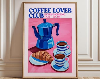 May include: A pink poster with the text "Coffee Lover Club" and "Every Morning 7AM - 10 AM". The poster features a blue coffee pot, two blue and white striped coffee cups, and a croissant on a blue plate.
