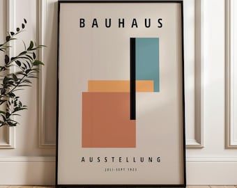 May include: A black and white poster with the text "BAHAUS" in bold, black letters. The poster features a geometric design with a vertical black line, a teal rectangle, and a peach rectangle. The text "AUSSTELLUNG" is below the design, and the text "JULI-SEPT 1923" is below that.