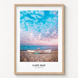 Cape May travel poster print in a natural wood frame on a wall
