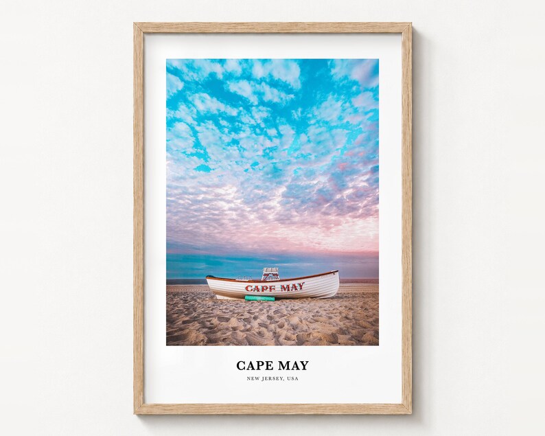 Cape May travel poster print in a natural wood frame on a wall