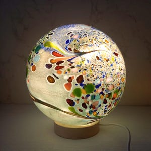Handcrafted Swirl Glass Sphere Lamp: Golden Amber Ambient Light