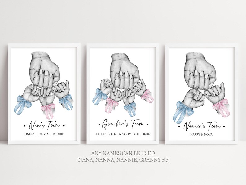 May include: Three framed art prints featuring a black and white pencil sketch of a large hand holding several smaller hands, each adorned with a small blue or pink watercolor ribbon. The text reads Nan's Team, Grandma's Team, and Nannie's Team.