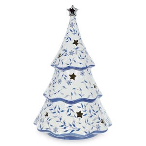 May include: A white ceramic Christmas tree figurine featuring a blue leaf pattern and snowflake motifs. The tree has three tiers with cut-out star shapes and is topped with a small silver-coloured star. The base and edges are trimmed in blue.