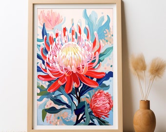 Puede incluir: Una impresión enmarcada de una vibrante flor de protea roja y rosa con hojas verdes sobre un fondo azul claro y rosa.