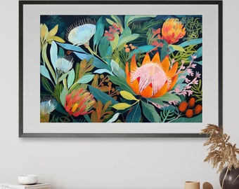 May include: A framed art print featuring a vibrant floral arrangement with orange, pink, and white proteas, surrounded by lush green foliage against a dark blue background.