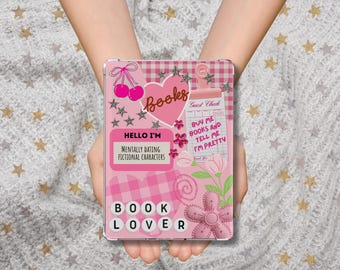 May include: A pink and white tablet case with a book-themed design. The case features the text "Books", "Hello I'm Mentally Dating Fictional Characters", and "Book Lover". Decorative elements include hearts, cherries, and flowers.