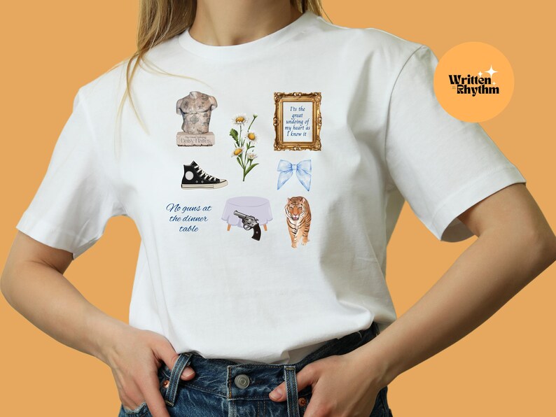 May include: White t-shirt with a variety of colorful illustrations, including a statue, flowers, a gun, a tiger, a table, a pair of shoes, and a bow. The text on the shirt reads "I'm the great undoing of my heart as I know it" and "No guns at the dinner table."