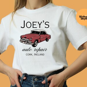 May include: White t-shirt with a red vintage car graphic and the text "JOEY'S auto repair CORK, IRELAND".