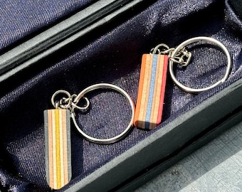 Handmade keychains made from recycled skateboards