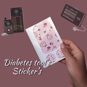 May include: A pink and white sticker sheet with a cute bunny rabbit design. The sticker sheet is for a diabetes tool and includes a large sticker for the tool and smaller stickers for the sensor.